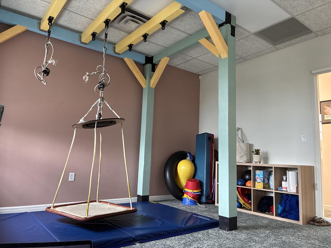 SLOT clinic therapy room featuring custom sensory suspension system and sensory integration equipment