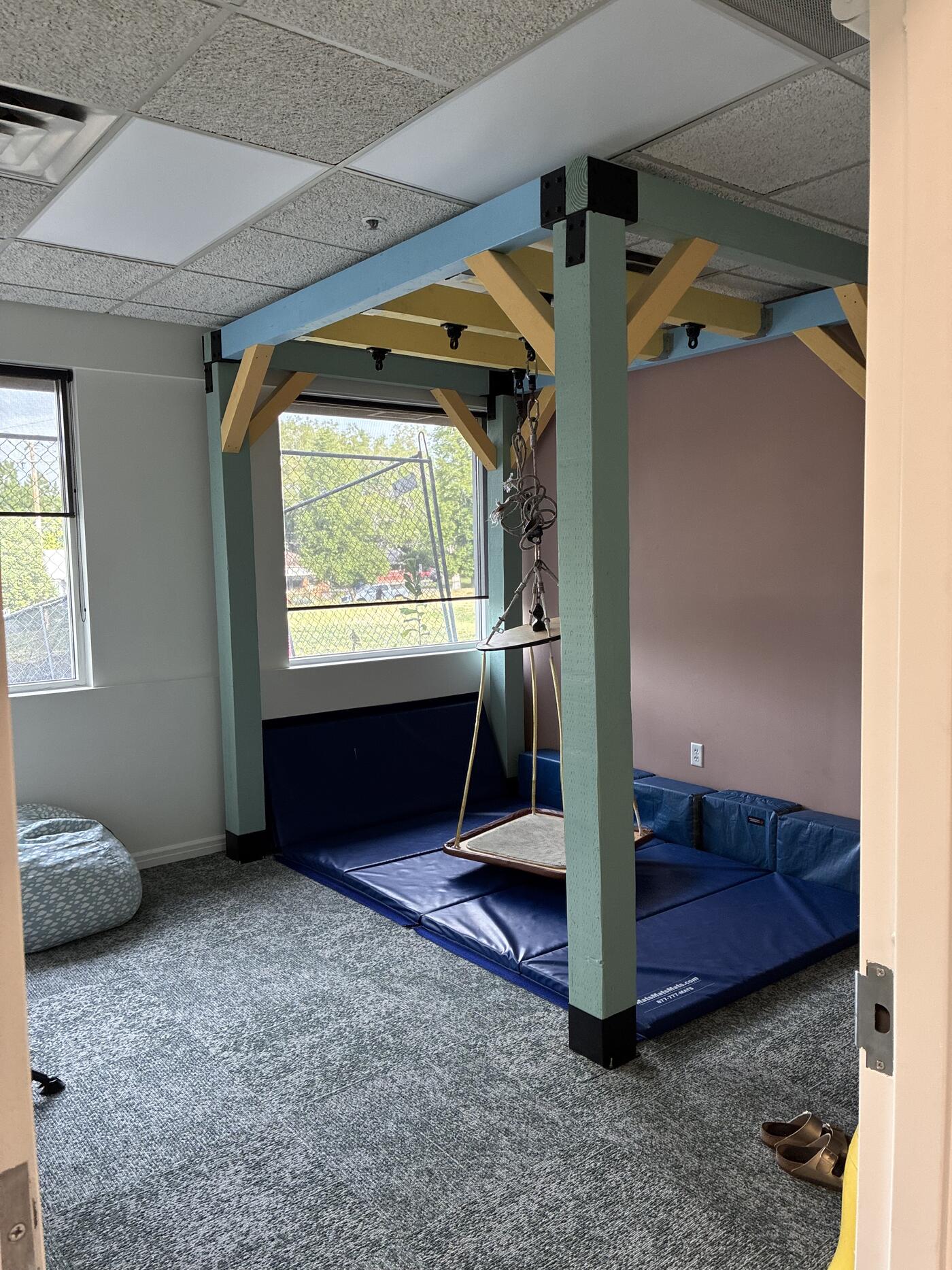 SLOT clinic sensory integration room with custom wooden suspension frame